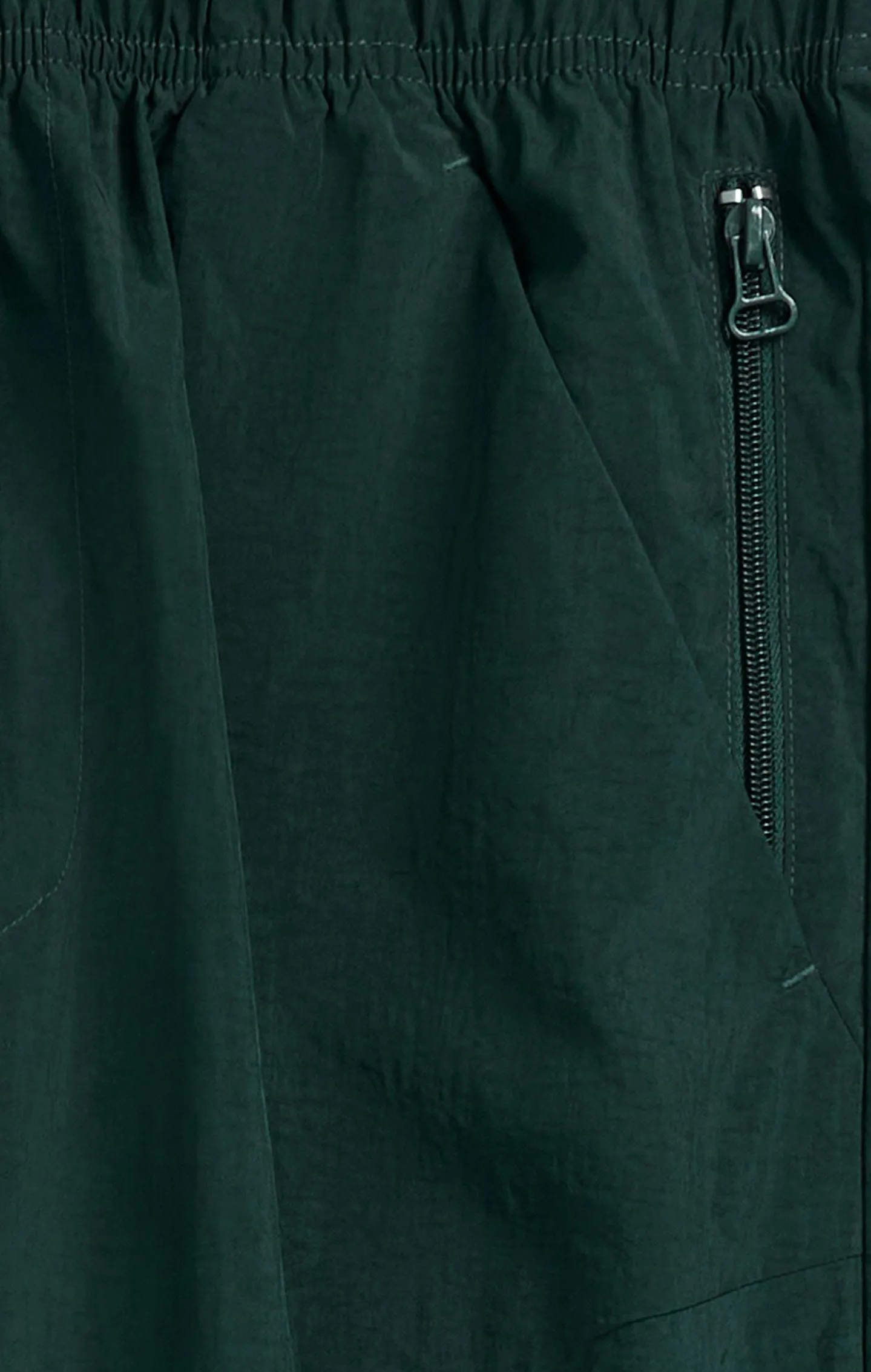 Pantalón de nailon con puños elásticos